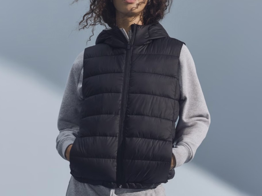 woman in black vest outside in snow