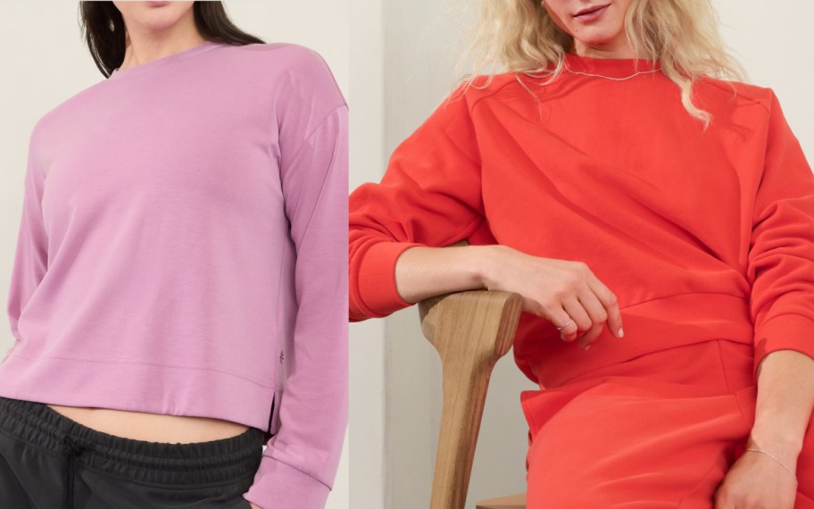 women in pink and red sweatshirts