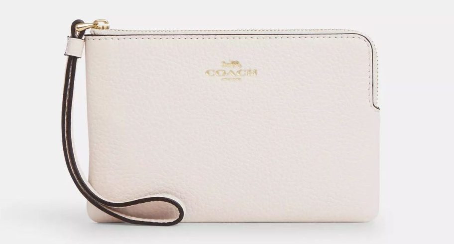 a white leather coach wristlet stock image