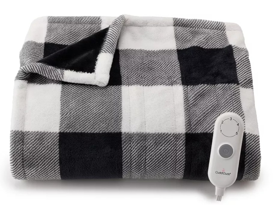 a black and white plaid heated blanket folded