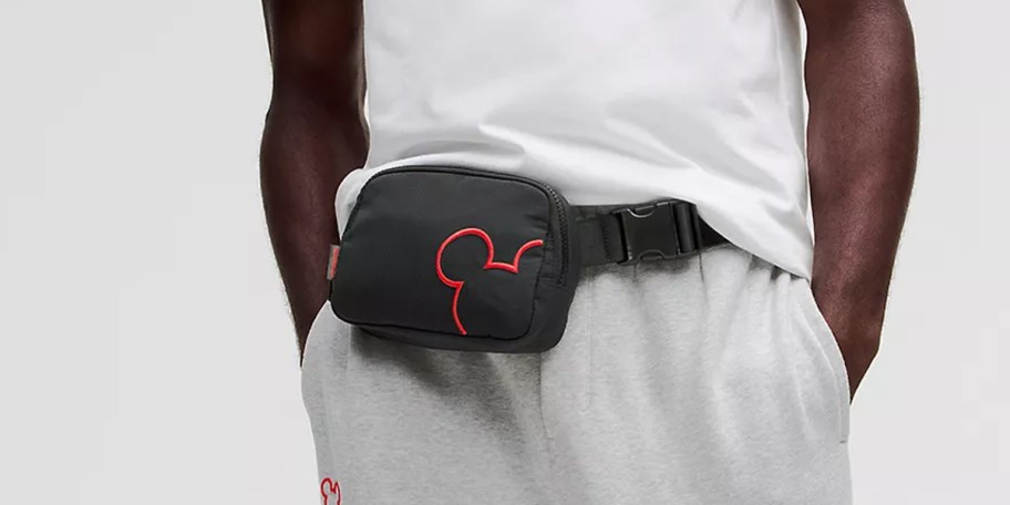 man wearing black mickey mouse everyday bag 