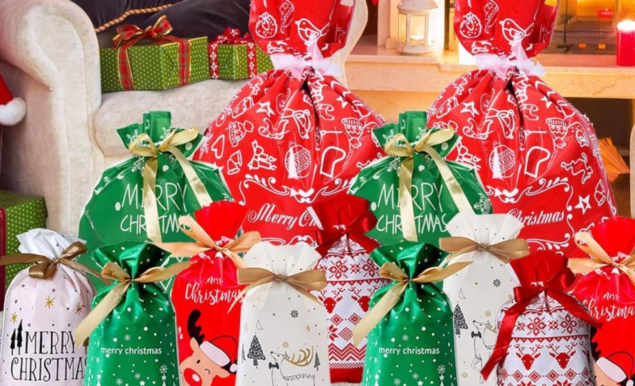 holiday drawstring gift bags in front of a fireplace