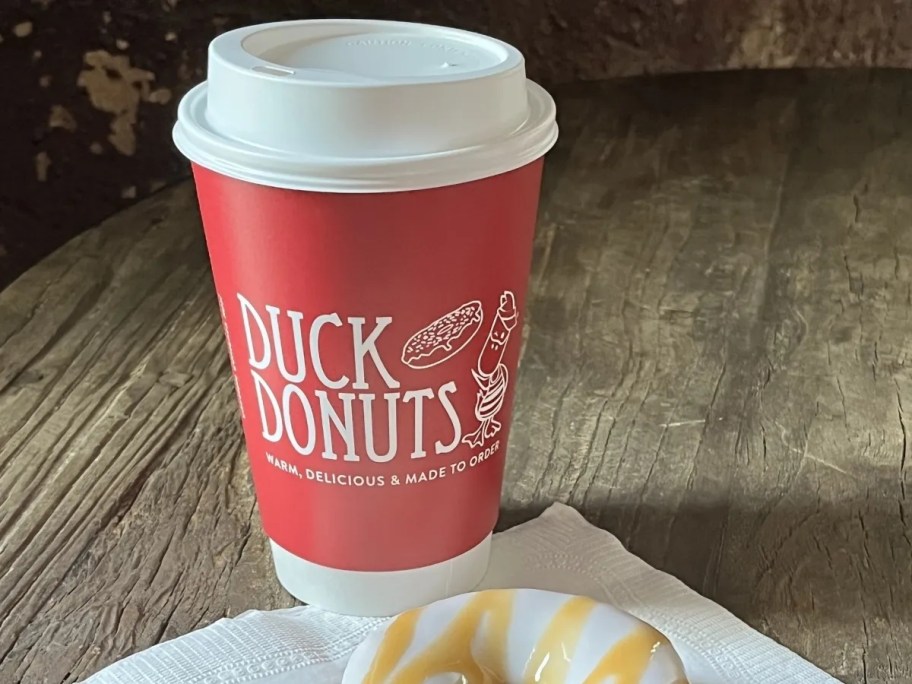 coffee in a red Duck Donuts cup