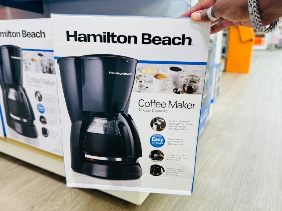 hand holding Hamilton Beach 12-Cup Coffee Maker  