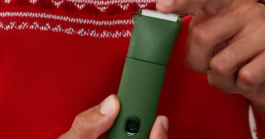 hand holding men's personal grooming trimmer