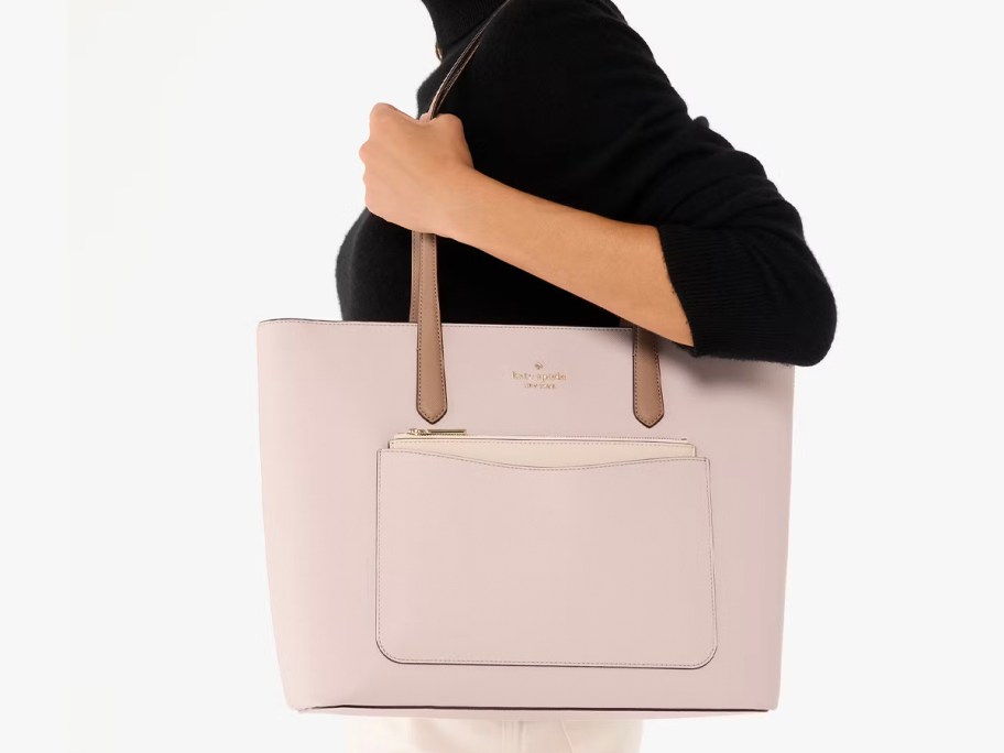 woman wearing pink kate spade tote 