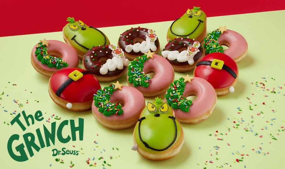 grinch and christmas donuts on green table