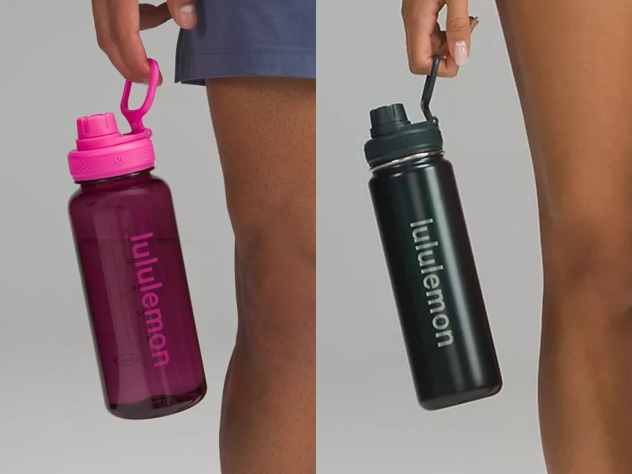 people's hands holding lululemon Water Bottles next to their legs, one bottle is pink, one is black