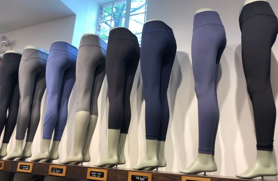 various styles of leggings on mannequins in a store