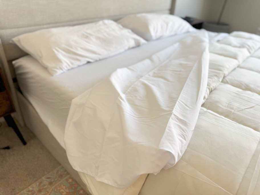 white sheet untucked on bed