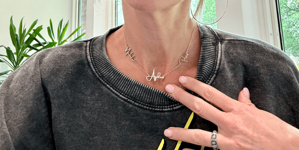 woman wearing name necklace 