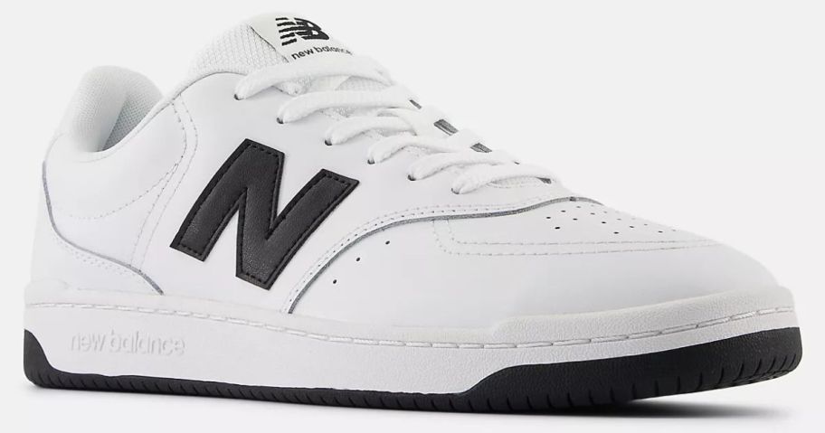 white and black New Balance Shoes