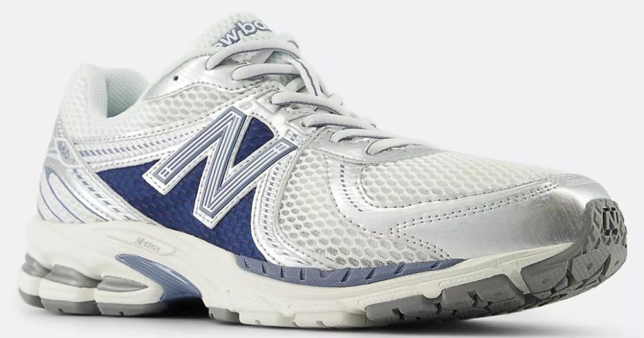 white and blue New Balance Shoes