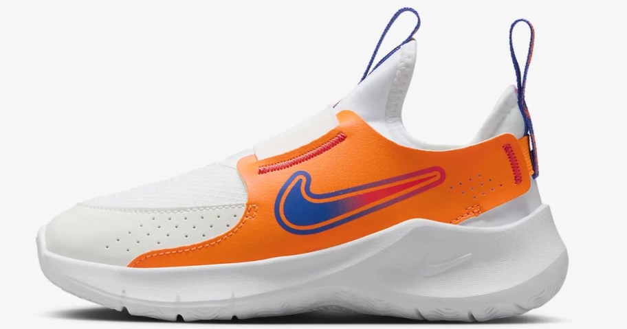 kid's Nike shoe in white with orange and blue accents