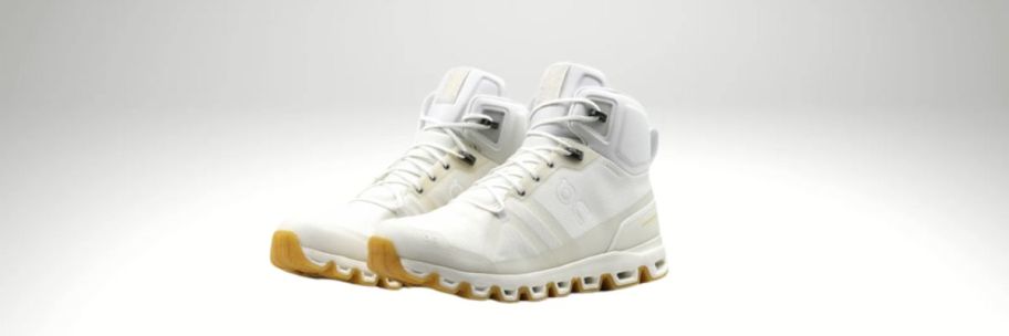 pair of white and yellow on cloud shoes