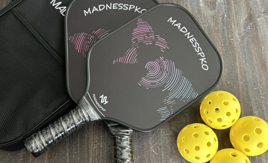 pickleball paddle set on wooden tableto