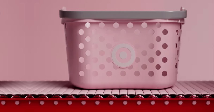 pink target toy basket on conveyor belt