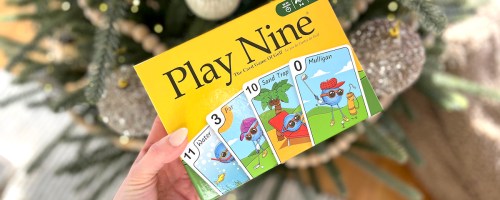 play nine card game in front of christmas tree