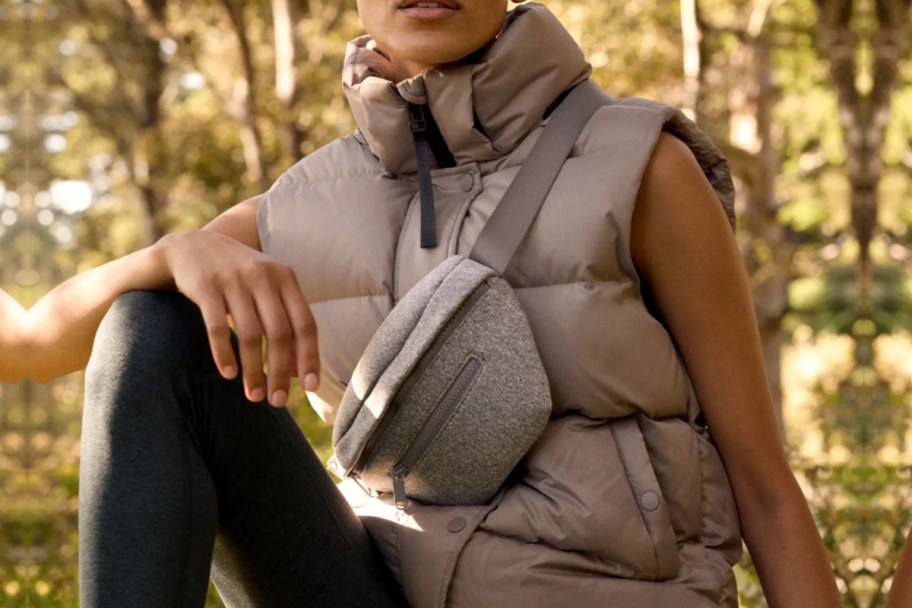 woman outside wearing puffer vest