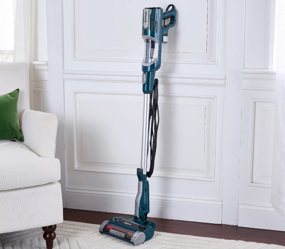 teal shark vacuum standing upright