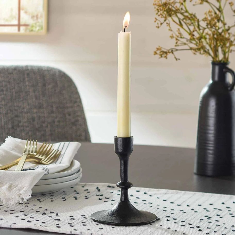 a cast iron taper candle holder