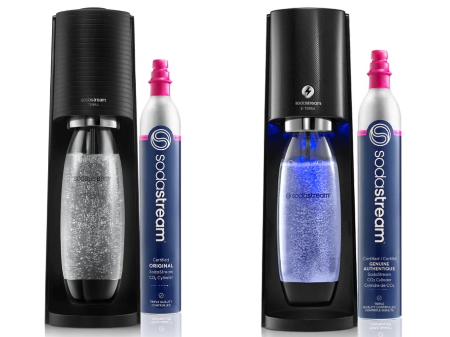 two black SodaStream machines with bottles in them and a CO2 cylinders