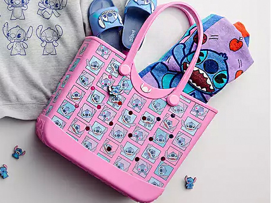 pink stitch bag laying on table with towel 