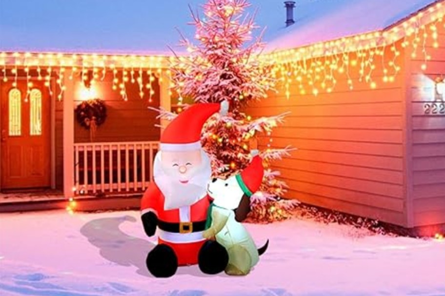 santa and dog inflatable in front of house 