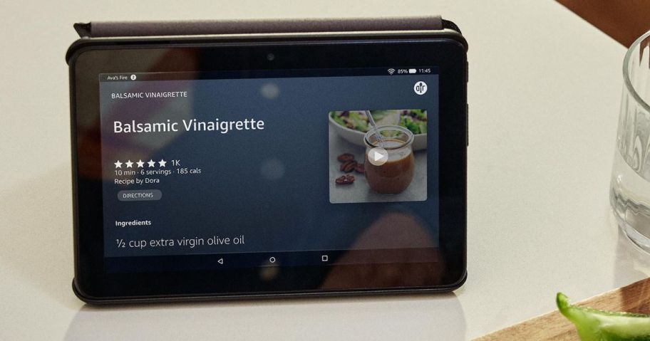 Amazon Fire 7″ 16GB Tablet on counter next to glass