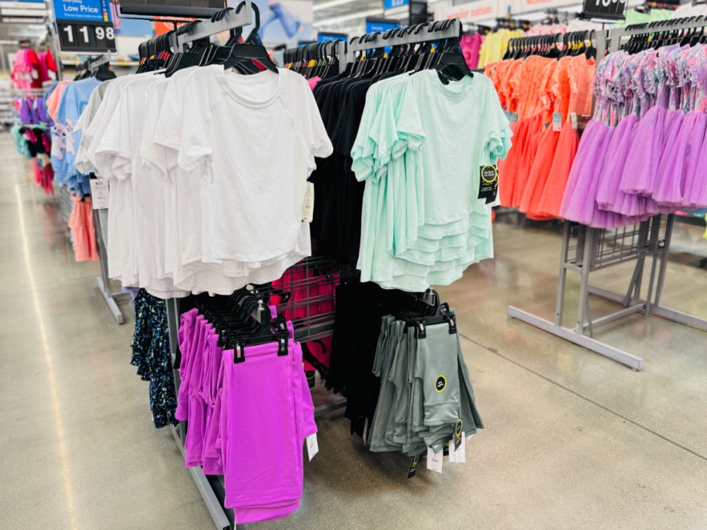 Girls T-shirts, and leggings hanging in Walmart store