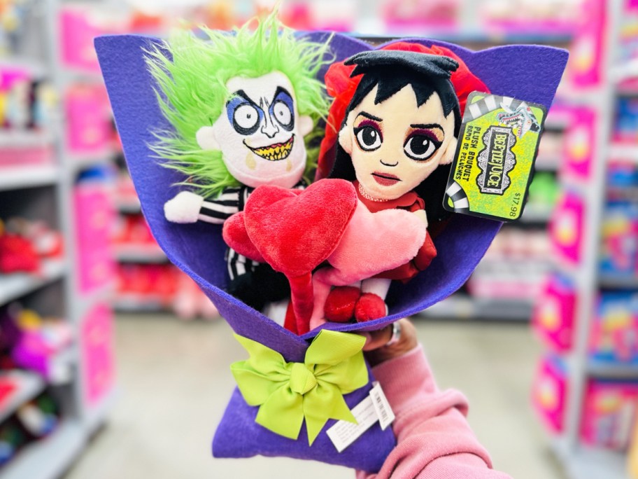 hand holding up Beetlejuice 5-Piece Plush Valentine's Bouquet in store