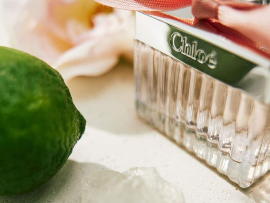 Chloe Roses De Chloe Eau de Toilette next to a lime