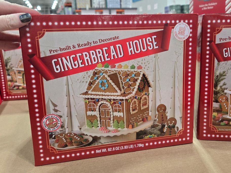 A Costco Prebuilt Gingerbread House in a store