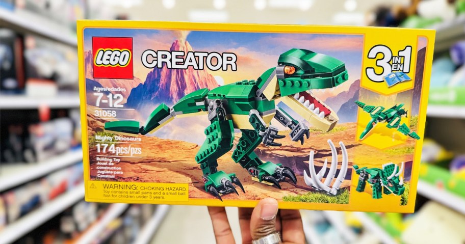 hand holding up box for EGO Creator 3-in-1 Mighty Dinosaur set