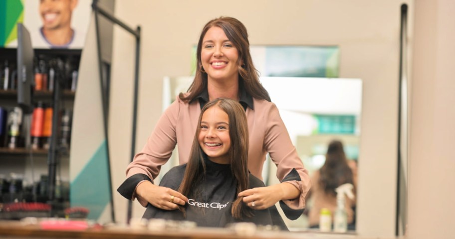 little girl getting haircut at great clips salon