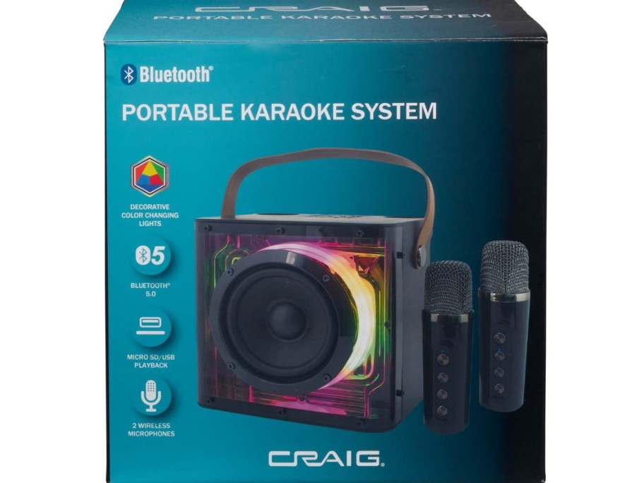 a blue box with a a small Karaoke machine with lights and 2 microphones 