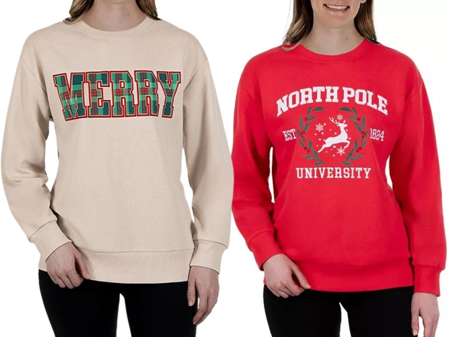 women wearing holiday sweatshirts, one is tan with the word "Merry" in green and red plaid letters and the other is red with "North Pole University" and a reindeer