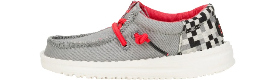 grey, black, and red heydude sneaker