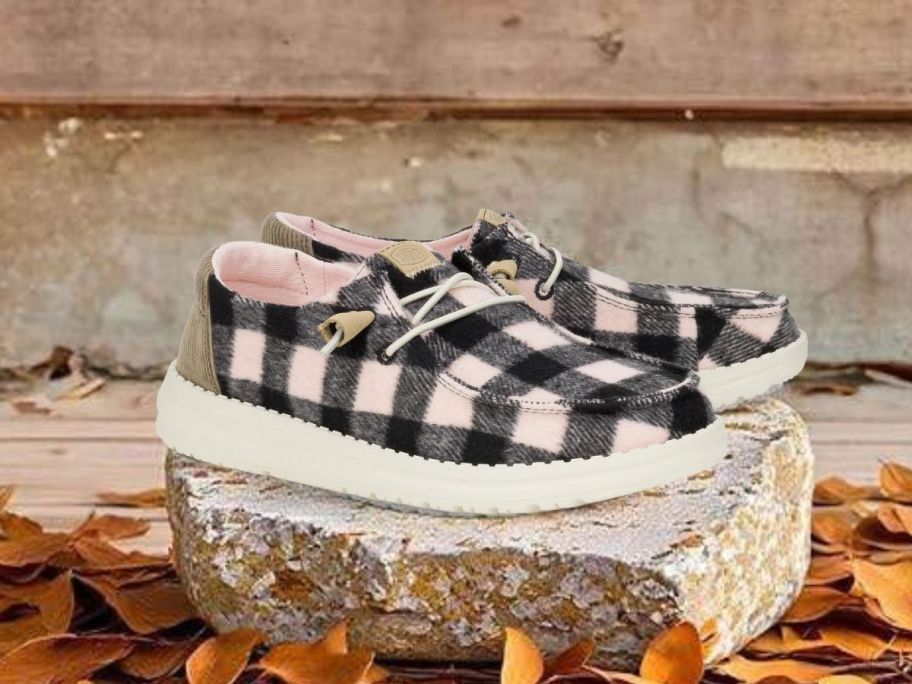 HEYDUDE Wendy Buffalo Plaid Shoes on rock outside