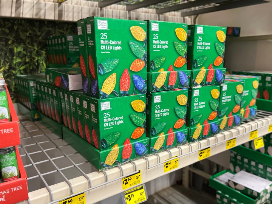 Boxes of multicolored holiday string lights on Home Depot store shelf