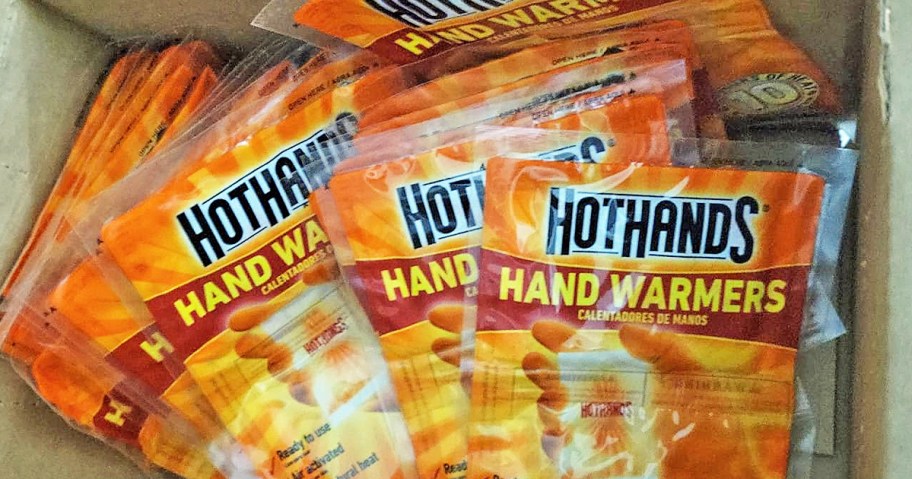 box full of multiple packs of HotHands Hand Warmers