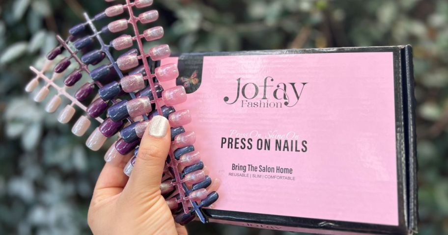 Hand Holding up a Jofay 120-piece Short Cat Eye Nail Kit