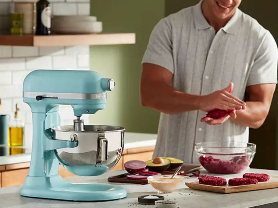 man using a kitchenaid mixer to make hamburger patties