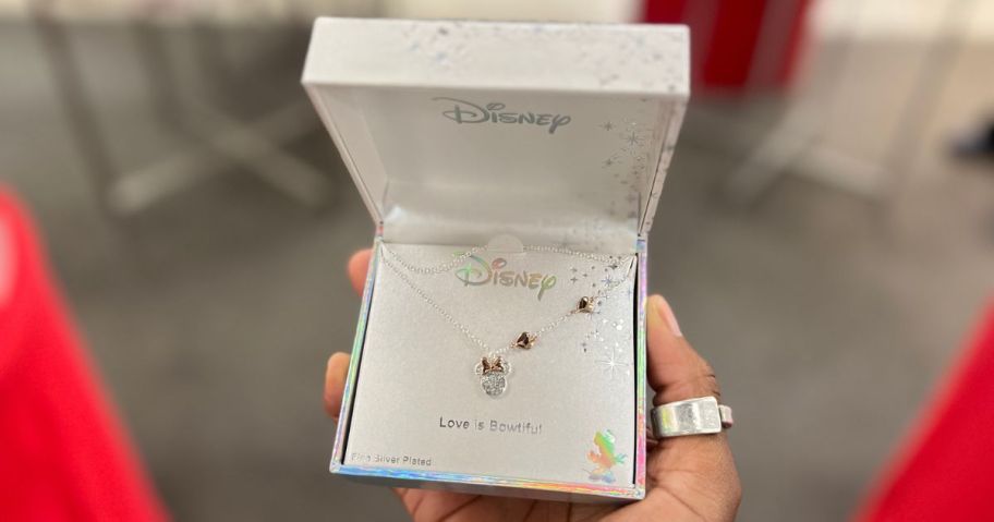 Hand holding a Minnie Mouse Boxed Necklace from Kohl's