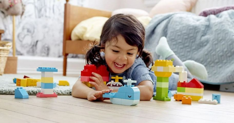 Little Girl Playing with the DUPLO Classic Heart Box