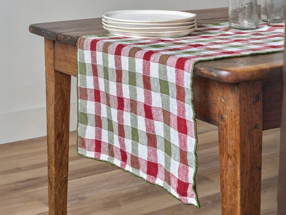 Magnolia Holiday Gingham Table Runner on table