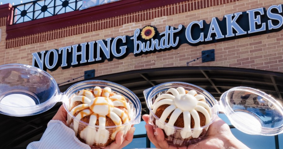 hands holding up mini bundt cakes outside of Nothing Bundt Cakes store