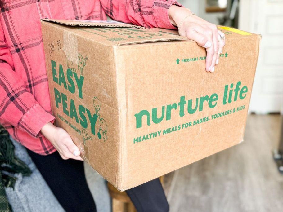 woman holding a Nurture Life Meal Box