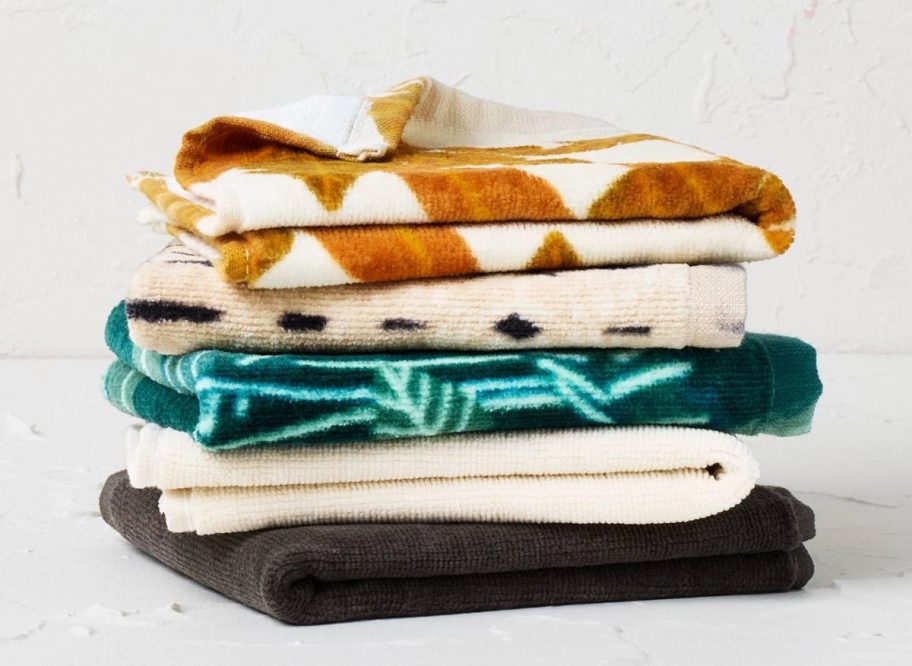 a stack of 5 colorful washcloths