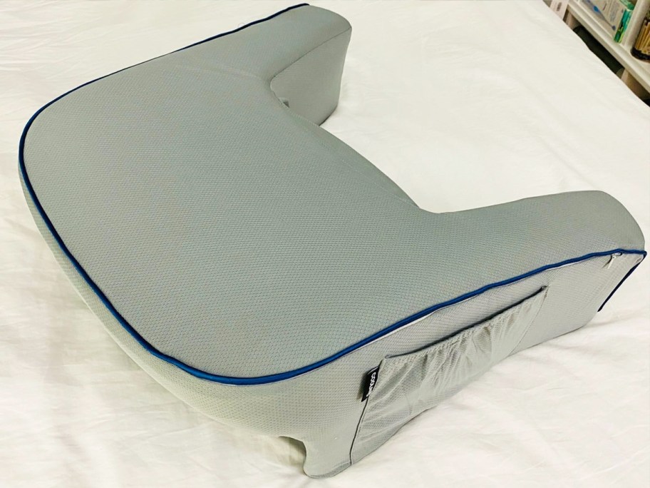 grey lap desk pillow on bed